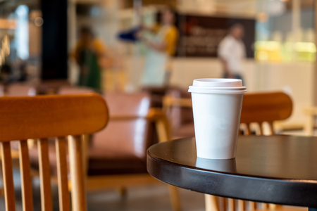 hot coffee paper cup in coffee shop and cafeの写真素材