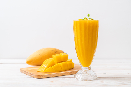 fresh mango smoothies - healthy food and drink conceptの写真素材