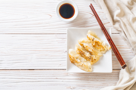 Japanese gyoza or dumplings snack with soy sauceの写真素材