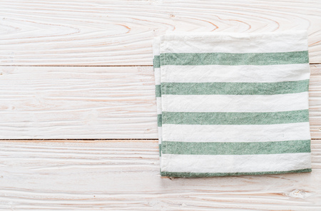 kitchen cloth (napkin) on wood backgroundの写真素材