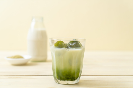 matcha green tea ice cube with milk in glassの写真素材