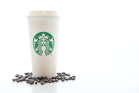 BANGKOK, THAILAND - JUN 5, 2018: White coffee cup with Starbucks logo isolated on white background. Starbucks is the world's largest coffee house with over 20,000 stores in 61 countries.のeditorial素材