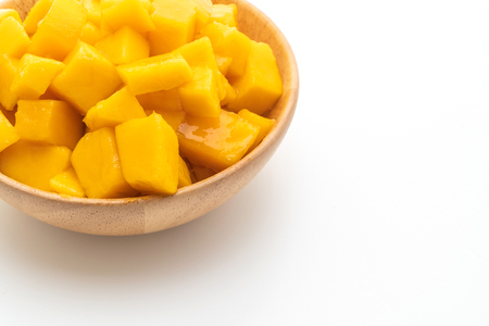 fresh and golden mangoes isolated on white backgroundの写真素材