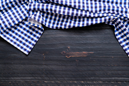 kitchen cloth (napkin) on wood background with copy spaceの写真素材