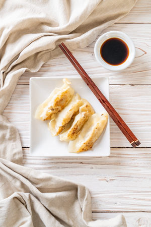 Japanese gyoza or dumplings snack with soy sauceの写真素材