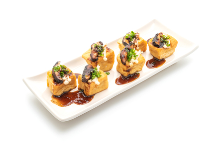 Grilled Tofu with Shitake Mushroom and Golden Needle Mushroom isolated on white backgroundの写真素材