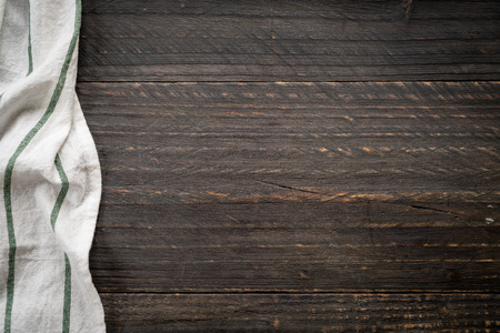 kitchen cloth (napkin) on wood background - vintage effect filterの写真素材
