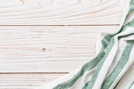 kitchen cloth (napkin) on wood background