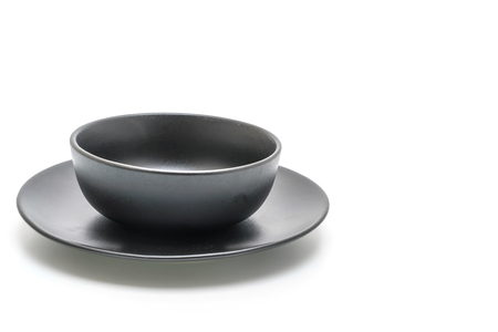 empty black plate and bowl isolated on white backgroundの写真素材