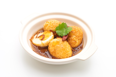 Fried Boiled Egg with Tamarind Sauce isolated on white backgroundの写真素材