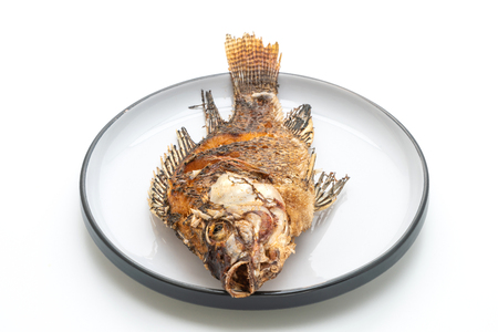 deep fried fish with spicy seafood sauce isolated on white backgroundの写真素材