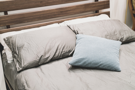 beautiful and comfortable pillow decoration on bed - vintage effect filterの写真素材