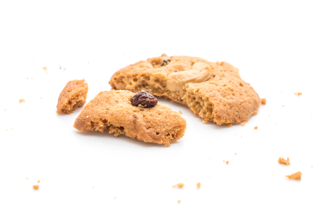 cookies with raisin and roasted cashew nuts isolated on white backgroundの写真素材