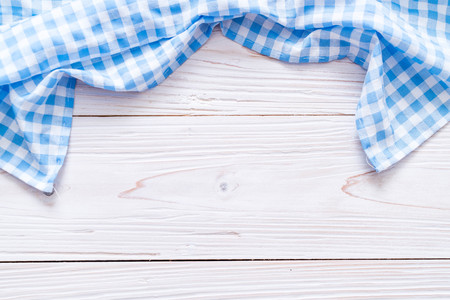 kitchen cloth (napkin) on wood background with copy spaceの写真素材