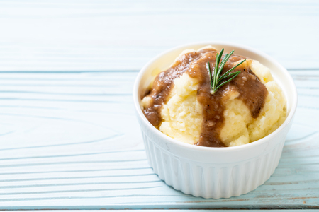 homemade mashed potatoes with gravy sauceの写真素材
