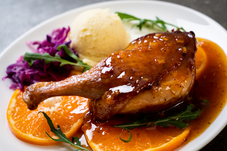 roasted duck leg steak with orange sauceの写真素材