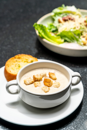 mushroom soup bowl with breadの写真素材