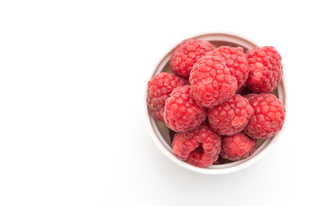 fresh raspberries isolated on white backgroundの写真素材