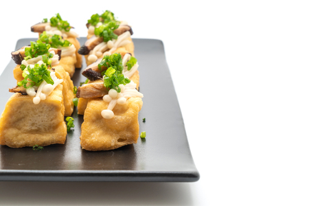 Grilled Tofu with Shitake Mushroom and Golden Needle Mushroom isolated on white backgroundの写真素材