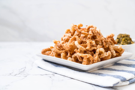 Fried pork rince or Pork snack with Nam Prik Num (Northern Thai Green Chilli Dip)