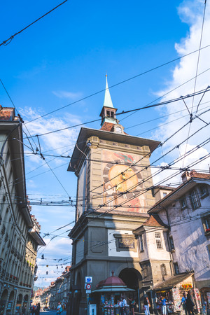 Bern, Switzerland - 23 AUG 2018: People on the shopping alley with the Zytglogge astronomical clock...