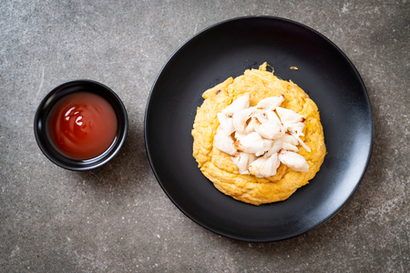omelet with crab meat and chili sauceの写真素材
