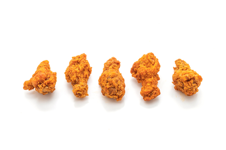 fried spicy chicken wings isolated on white backgroundの写真素材