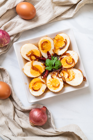 Fried Boiled Egg with Tamarind Sauce or Sweet and Sour Eggsの写真素材