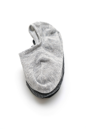 stack of short socks isolated on white backgroundの写真素材