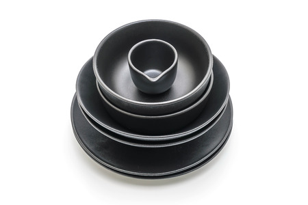 empty black plate and bowl isolated on white backgroundの写真素材