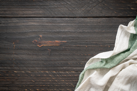 kitchen cloth (napkin) on wood background - vintage effect filterの写真素材