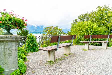 empty bench with Thun Lake background in Switzerlandの写真素材