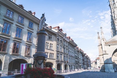 Bern, Switzerland - 23 AUG 2018: People on the shopping alley with the Zytglogge astronomical clock...
