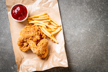 Fried chicken with french fries and nuggets meal - junk food and unhealthy foodの写真素材