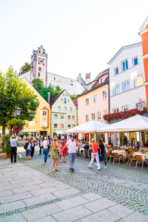 FUSSEN, GERMANY - AUG 28, 2018: Street cafe in the Fussen old town city centre. Fussen is a small town in Bavaria, Germany.のeditorial素材