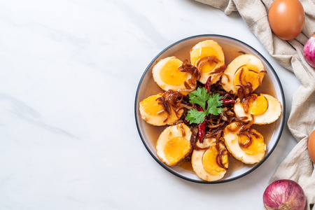 Fried Boiled Egg with Tamarind Sauce or Sweet and Sour Eggsの写真素材