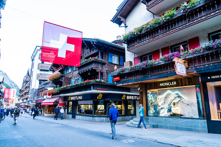 ZERMATT, SWITZERLAND - AUG 26, 2018: Tourists at street view of old town Zermatt at the center in Zermatt, Switzerland.のeditorial素材