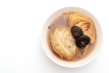boiled cabbage in red soup with mushroom isolated on white backgroundの写真素材