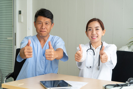 Asian Senior Patient Having Consultation With Doctor in Office  - selective focus pointの写真素材
