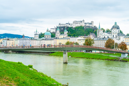 Salzburg City with Festung Hohensalzburg and Salzach river in Austriaのeditorial素材