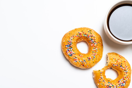 Donut with colorful sprinkles - top viewの写真素材