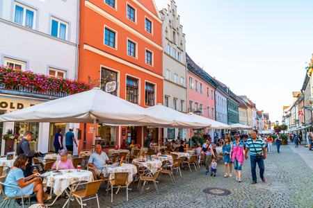 FUSSEN, GERMANY - AUG 28, 2018: Street cafe in the Fussen old town city centre. Fussen is a small town in Bavaria, Germany.のeditorial素材