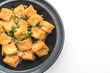 Fried Tofu in a bowl with sesame isolated on white backgroundの写真素材