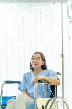 Asian female patient on wheelchairの写真素材