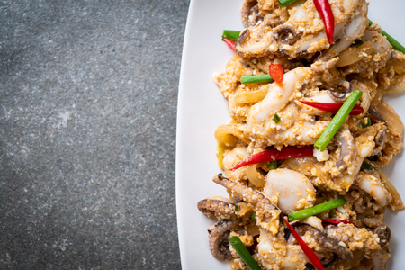 Stir-Fried Squid or Octopus with Salted Eggs - Asian seafood styleの写真素材