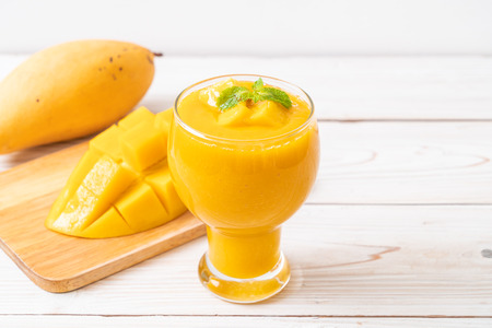 fresh mango smoothies - healthy food and drink conceptの写真素材
