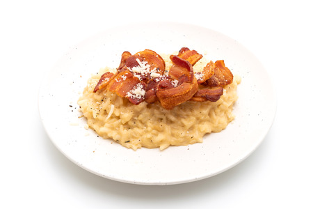 risotto with crispy bacon isolated on white backgroundの写真素材