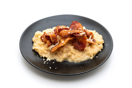 risotto with crispy bacon isolated on white backgroundの写真素材