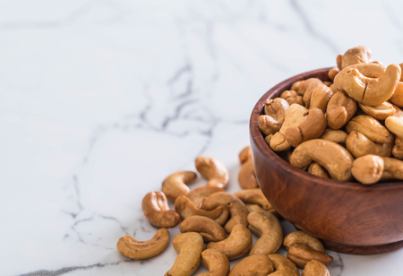 Roasted cashew nuts in bowlの写真素材