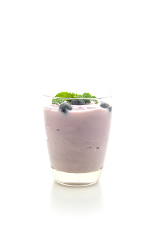 yogurt with fresh blueberries isolated on white backgroundの写真素材